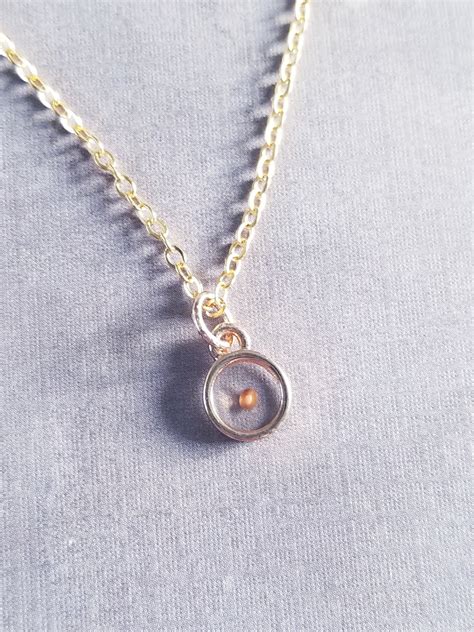 24 $ 47. . 14k gold mustard seed necklace